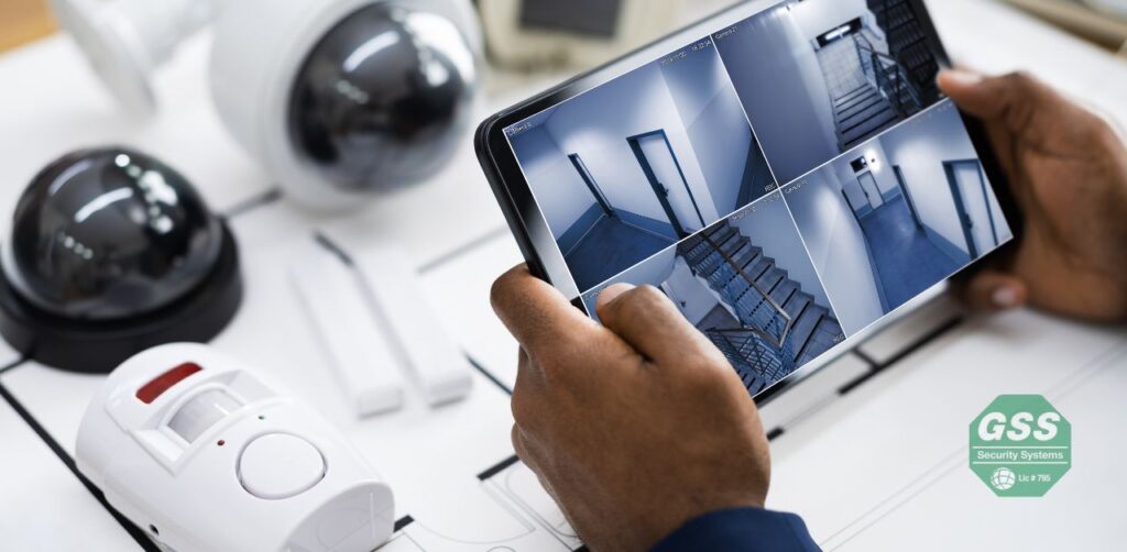  modern, affordable home alarm system on a wooden table.