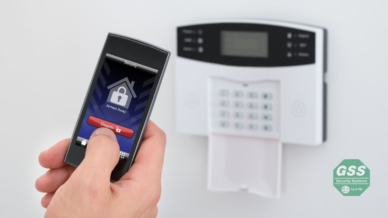 A father happily configuring his new smart security system provided by Globelink Systems.