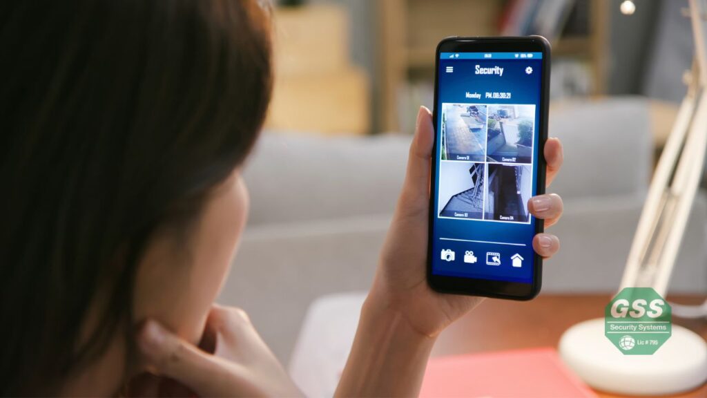 Mother easily managing her home's security from a smart device.