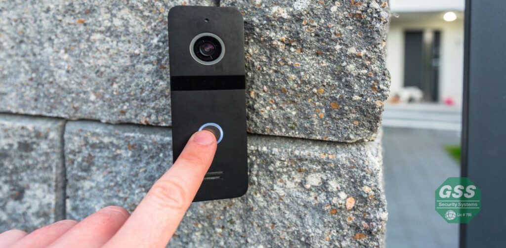 A person using a fingerprint scanner to access a secured gate.